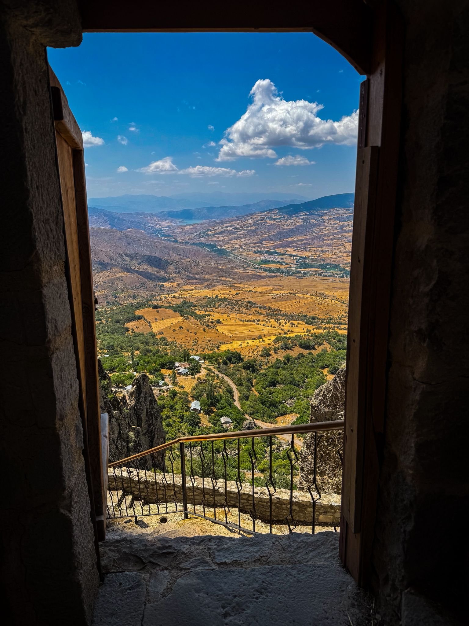 Mountain valley through doorway